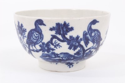 Lot 3 - A Worcester blue and white tea bowl and saucer, circa 1770-85, printed with the Birds in Branches pattern, crescent marks to bases, the saucer measuring 12cm diameter