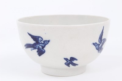 Lot 3 - A Worcester blue and white tea bowl and saucer, circa 1770-85, printed with the Birds in Branches pattern, crescent marks to bases, the saucer measuring 12cm diameter