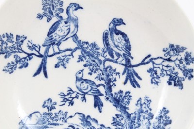 Lot 4 - A Worcester blue and white tea bowl and saucer, circa 1770-85, printed with the Birds in Branches pattern, crescent marks to bases, the saucer measuring 12.5cm diameter