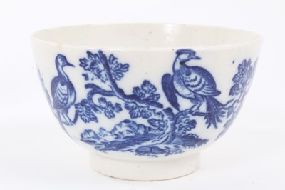 Lot 4 - A Worcester blue and white tea bowl and saucer, circa 1770-85, printed with the Birds in Branches pattern, crescent marks to bases, the saucer measuring 12.5cm diameter