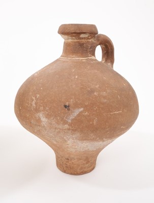 Lot 11 - Two 15th/16th century German salt-glazed stoneware mugs with thumbed footrims, together with a stoneware jug and flask probably of similar age, the largest measuring 26cm high (4)
