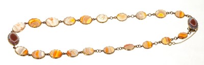 Lot 404 - Georgian agate necklace, with two clasps to adapt to two bracelets, in gold collet setting