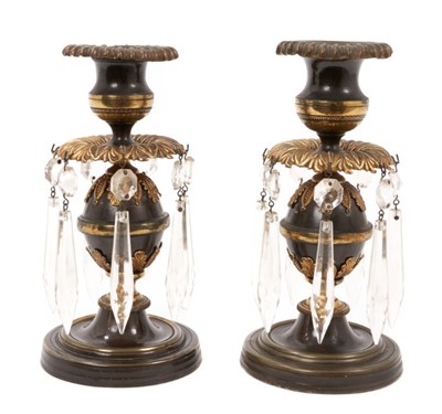 Lot 766 - Pair of Regency bronze and ormolu dwarf candlesticks with prismatic drops