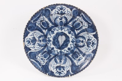 Lot 15 - Two 18th century blue and white English/Dutch delftware dishes, together with a larger delftware dish with piercrust rim measuring 29.5cm diameter (3)