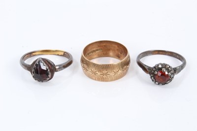 Lot 459 - Two garnet rings and a 9ct gold wedding ring (3)