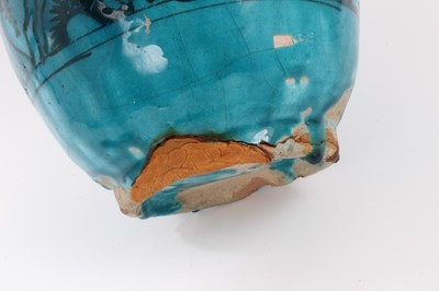 Lot 28 - An Eastern turquoise-glazed pottery vase, 27cm high, and a similar dish painted with flowers (2)