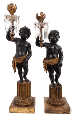 Lot 1062 - Pair of early 19th century candlesticks with putto supports and prismatic drops.