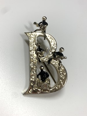 Lot 1 - 1960s Beatles brooch by Exquisite, the larger capital  B decorated with musical notes