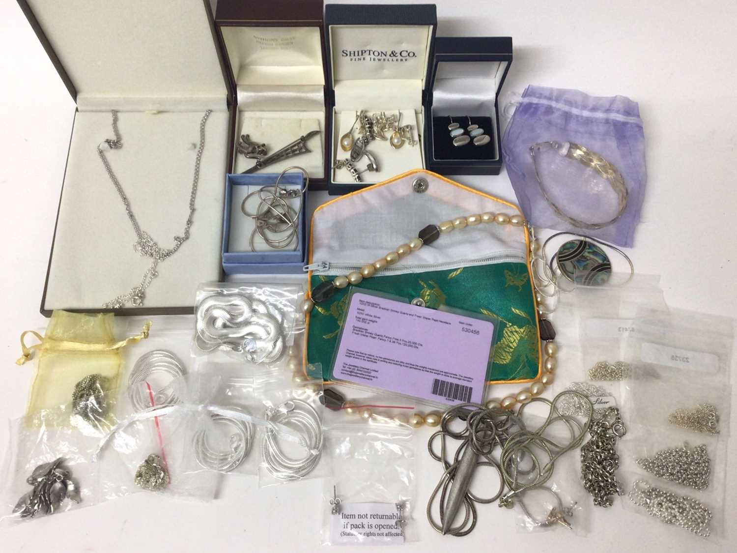Lot 67 - Group of silver chains, some new in packets, silver pendants, earrings and brooches