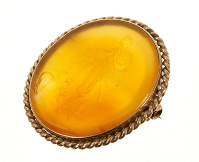 Lot 471 - Carved hardstone intaglio brooch with carved decoration depicting a classical figure with Cupid