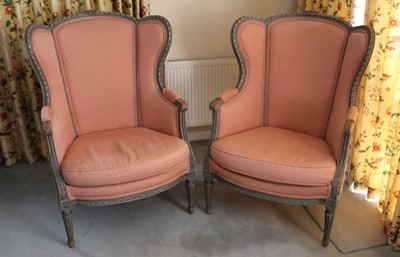 Lot 1236 - Pair of French-style easy chairs with carved and painted frames, pink upholstery, on fluted tapered legs, 106cm high