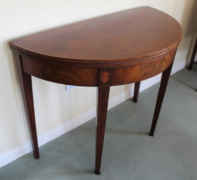 Lot 1238 - George III inlaid mahogany demi-lune card table with fold-over top inlaid with barber pole strung crossbanding, on sqaure taper legs, 91cm x 45cm