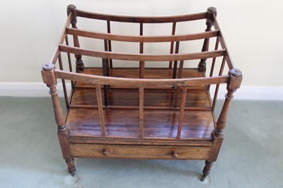 Lot 1244 - Victorian rosewood Canterbury with single drawer, on ring turned legs and brass castors, 56cm x 41cm