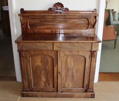 Lot 1248 - Victorian mahogany chiffonier with raised ledge back above two frieze drawers and twin arched panelled cupboards below, on plinth base, 106cm x 39cm