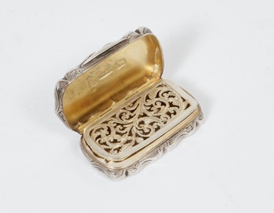 Lot 251 - Victorian silver vinaigrette of shaped rectangular form, with foliate engraved decoration