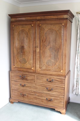 Lot 1256 - 19th century inlaid mahogany linen press, the dentil cornice above twin inlaid panelled doors enclosing five slides, above two short and two lon drawers, on bracket feet, 131cm wide x 60cm deep x 2...