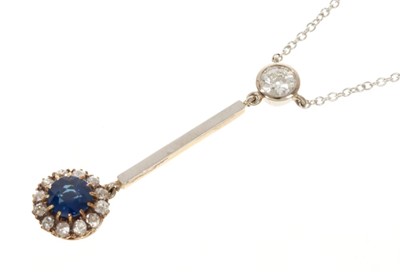 Lot 445 - Sapphire and diamond pendant necklace with a sapphire and old cut diamond cluster suspended from a round old cut diamond in platinum setting on trace chain
