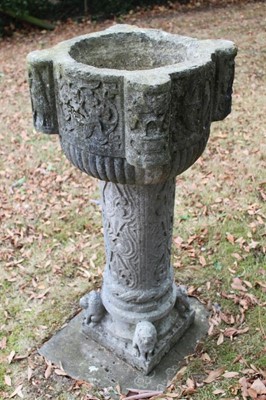 Lot 1260 - Antique carved stone font, on carved column and square base mounted with seated lions, 108cm high, the font 41cm square