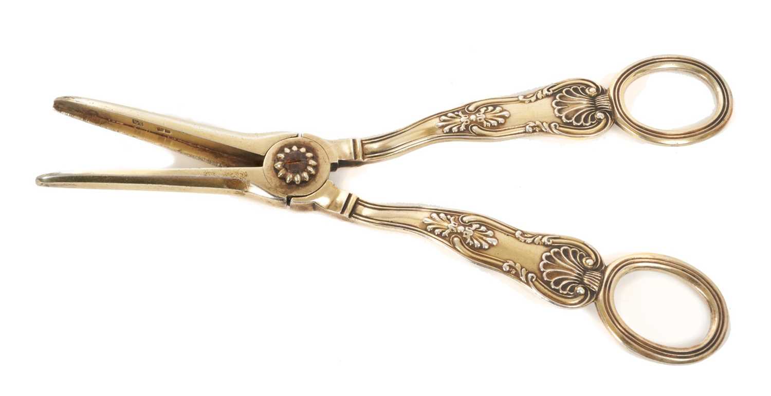 Lot 12 - A pair of silver gilt grape scissors, Howe crest