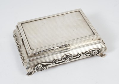 Lot 384 - Unusual George V silver table tobacco box in the form of a Chinese low table with engine turned decoration and applied scroll decoration, raised on four scroll feet, (London 1910)