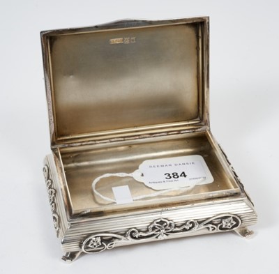 Lot 384 - Unusual George V silver table tobacco box in the form of a Chinese low table with engine turned decoration and applied scroll decoration, raised on four scroll feet, (London 1910)