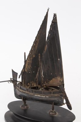 Lot 386 - Continental silver model of a boat, on oval stand, the model marked 800, 18.8cm in height (including stand).