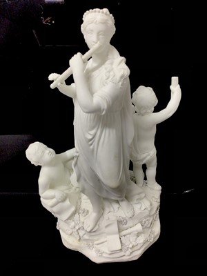 Lot 48 - A Derby bisque group emblematic of music, late 18th/early 19th century, representing a robed woman and two cherubs playing instruments, incised model number 217 to base, 29cm high