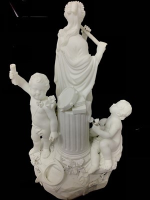 Lot 48 - A Derby bisque group emblematic of music, late 18th/early 19th century, representing a robed woman and two cherubs playing instruments, incised model number 217 to base, 29cm high