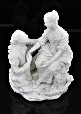 Lot 52 - A rare Derby bisque group of the Alpine Sherpherdess, late 18th century, after a model by Etienne-Maurice Falconet, the shepherd and shepherdess seated holding hands, a recumbent lamb at her side,...