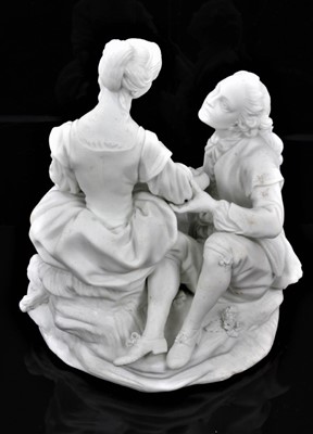 Lot 52 - A rare Derby bisque group of the Alpine Sherpherdess, late 18th century, after a model by Etienne-Maurice Falconet, the shepherd and shepherdess seated holding hands, a recumbent lamb at her side,...