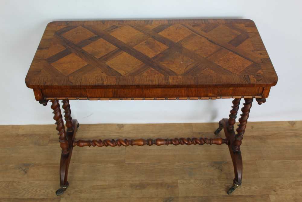 Lot 1263 - Mid Victorian rosewood and parquetry side table, rounded rectangular specimen wood inlaid top over reel moulded frieze with concealed drawer, on barley twist understructure and castors, 91cm wide x...