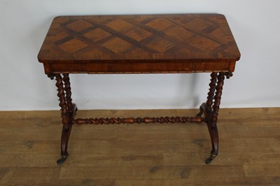 Lot 1263 - Mid Victorian rosewood and parquetry side table, rounded rectangular specimen wood inlaid top over reel moulded frieze with concealed drawer, on barley twist understructure and castors, 91cm wide x...