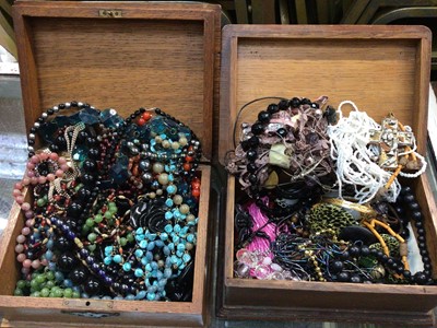 Lot 1036 - Two wooden jewellery boxes containing various bead necklaces