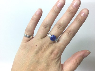 Lot 408 - A fine sapphire and diamond three stone ring