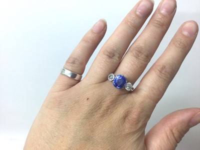 Lot 408 - A fine sapphire and diamond three stone ring