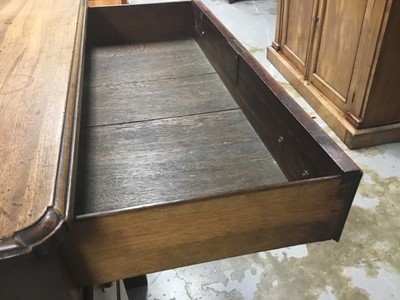 Lot 1269 - George II mahogany kneehole dressing table, the top with re-entrant angles and seven drawers and flush concealed apron drawer about the cupboard kneehole, 76cm x 50cm x 80cm