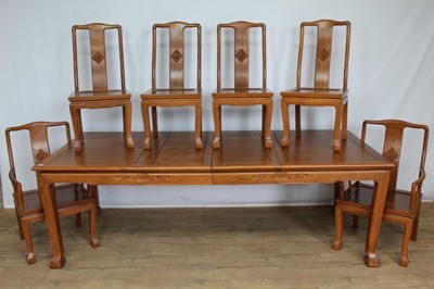 Lot 1274 - Impressive suite of Chinese carved hardwood dining furniture, comprising extending dining table with two additional leaves, (152cm long x 113cm deep, extending to approximately 240cm) set of ten yo...