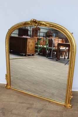 Lot 1275 - Victorian arched gilt framed overmantel mirror, gadrooned cushion frame with shell cresting, 111 x 119cm