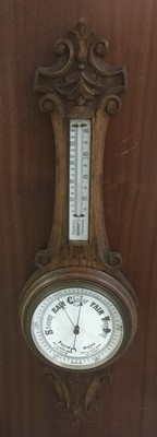 Lot 271 - Late Victorian aneroid barometer and thermometer in carved oak case