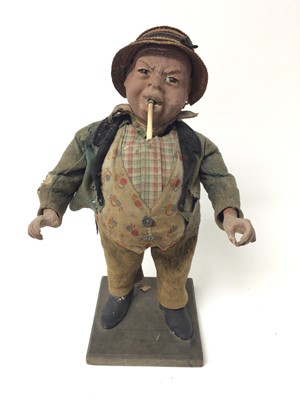 Lot 860 - Early 20th century advertising automaton in the form of a portly man smoking, with glass eyes