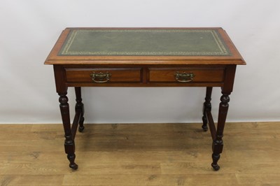 Lot 1402 - Late Victorian mahogany writing table with green tooled leather top, two drawers on turned legs