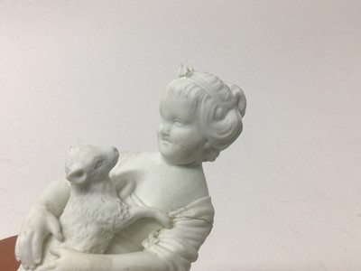 Lot 55 - A pair of Derby bisque figures of a barefooted boy and girl, late 18th/early 19th century, the boy playing with a dog and the girl holding a lamb, incised model numbers 57, together with another De...