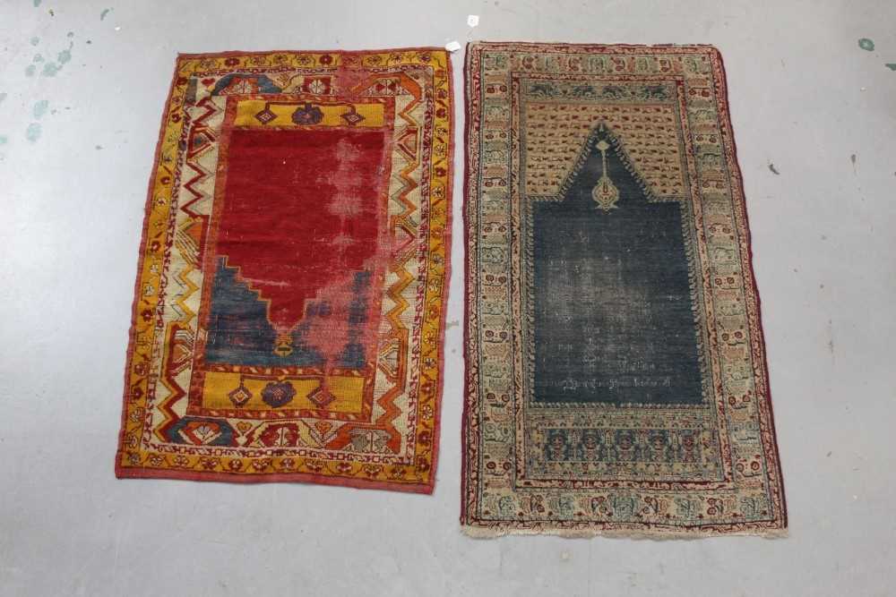Lot 1431 Two antique Eastern prayer rugs