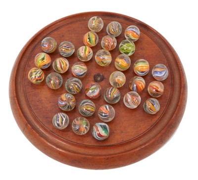 Lot 761 - Collection of 32 Victorian multi-twist glass marbles on solitaire board