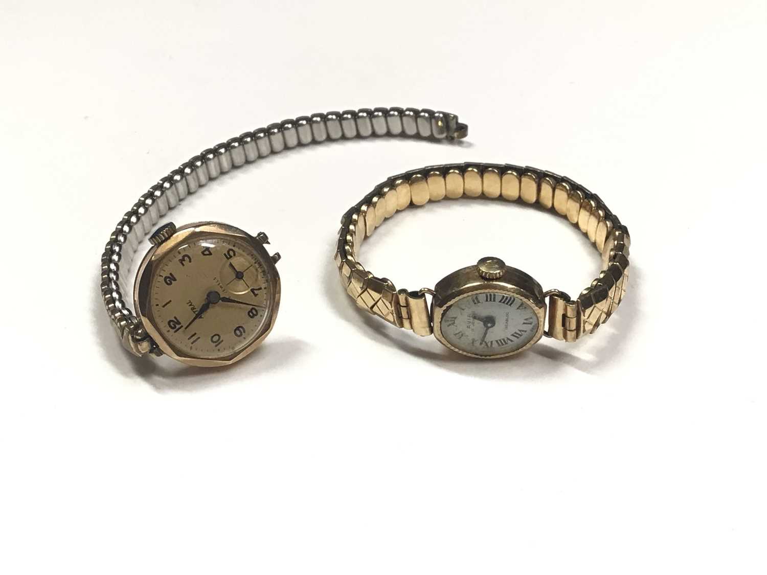 Lot 36 - Two 9ct gold cased ladies wristwatches, both on expandable plated bracelets