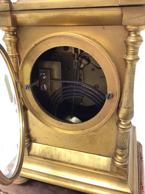 Lot 663 - Late 19th century French gilt brass mantel clock with enamelled and gilt metal dial, French movement striking on bell signed J.Mati in gilt metal case on plinth , pendulum and key present 30.5 cm