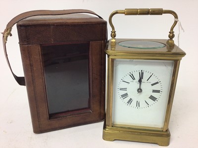 Lot 671 - Early 20th century French carriage clock retailed by Alex Clark Co Ltd, Paris, movement striking on gong 18 cm high in leather travelling case with key