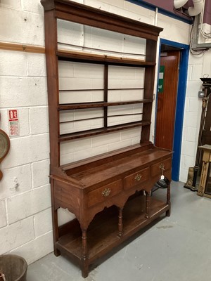 Lot 1220 - 18th century oak dresser with open rack above three drawers and pot board below