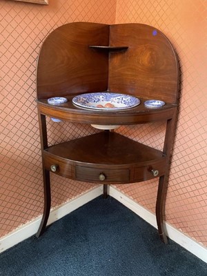 Lot 1221 - George III mahogany corner washstand