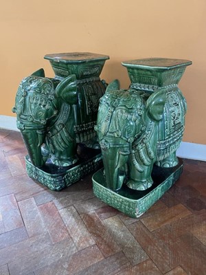 Lot 1212 - Pair of green glazed Elephant garden seats, 60cm high